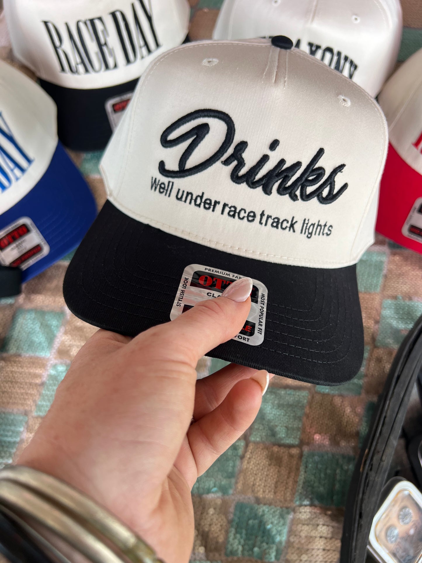 “Drinks Well Under Race Track Lights” Hat